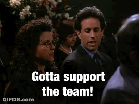 Suited Man And Woman Gotta Support The Team GIF