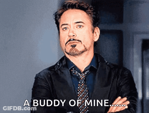 Suited Man Crossed Arms Says Buddy Of Mine GIF