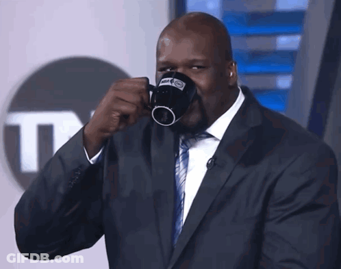 Suited Man Drinking From NBA Mug GIF