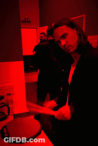 Suited Man In Dark Room With Red Light Saying Ikea GIF