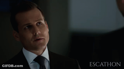 Suited Man Looking At Another Escathon GIF