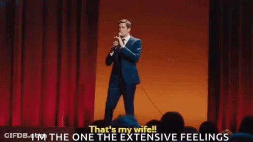 Suited Man On Green Carpet Before Matrix Sign GIF