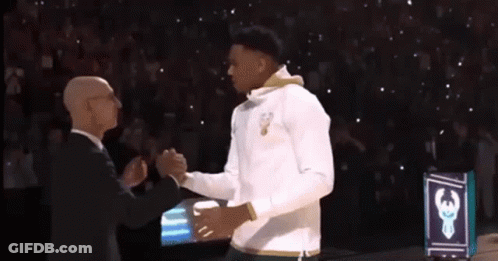 Suited Man Shakes Hands Basketball Player White Shirt GIF