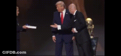 Suited Man Shaking Hands Woman Holding Paper GIF