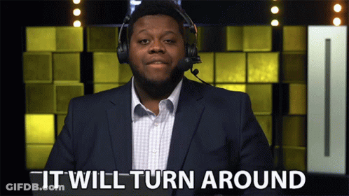 Suited Man With Headphones Saying It Will Turn Around GIF