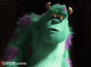 Sulley From Monsters Inc Is A Green And Purple Furry Monster With Horns And A Surprised Look On His Face . GIF