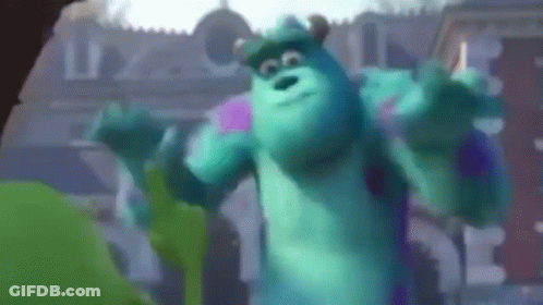 Sulley From Monsters Inc Is Dancing In Front Of A Building In A Blurry Photo . GIF