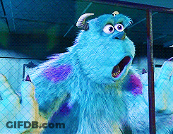 Sulley From Monsters Inc Is Standing In Front Of A Fence With His Mouth Open GIF