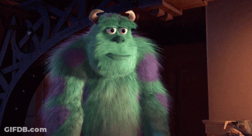 Sulley From Monsters Inc Is Standing In Front Of A Pillar GIF