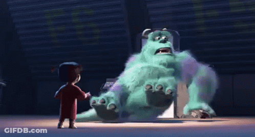 Sulley From Monsters Inc Is Standing Next To A Girl In A Red Shirt . GIF