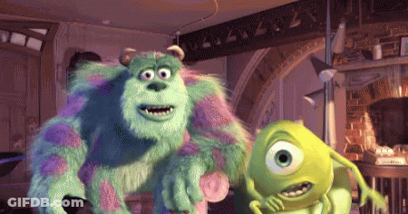 Sully And Mike From Monsters Inc Are Standing Next To Each Other In A Room GIF