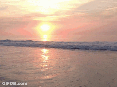Sun Setting Over Breaking Waves GIF