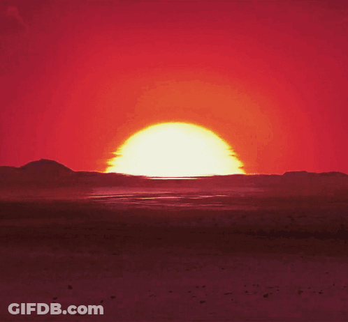 Sun Setting Over Desert Mountains GIF