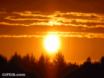 Sun Shining Through Clouds In Sky GIF