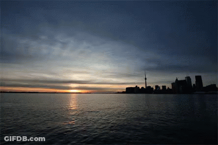 Sunset Over City Skyline GIF