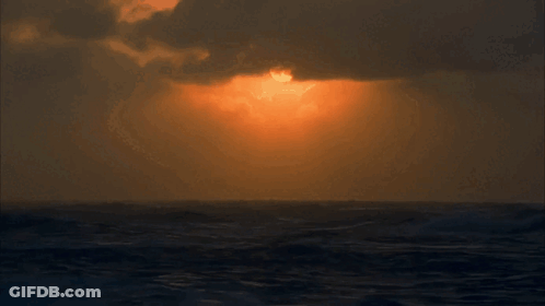 Sunset Over Ocean With Clouds GIF