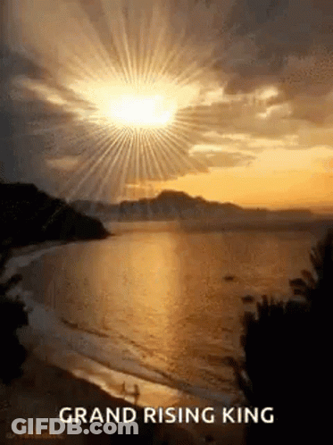 Sunset Over Ocean With Sun Through Clouds GIF