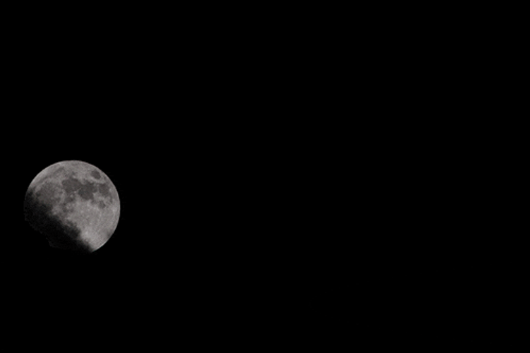 Super Moon And Silhouette Of Clouds GIF
