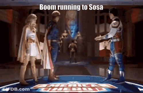 Superhero Group On Stage With Boom Running To Sosa Sign GIF