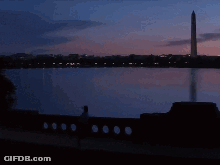 Superhero Man In Front Of Ambulance At Night GIF