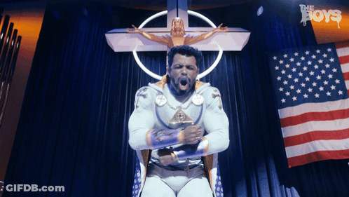 Superhero Man In Front Of Flag And Cross GIF