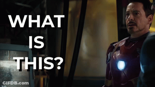 Superhero Man In Front Of Screen Saying What Is This GIF
