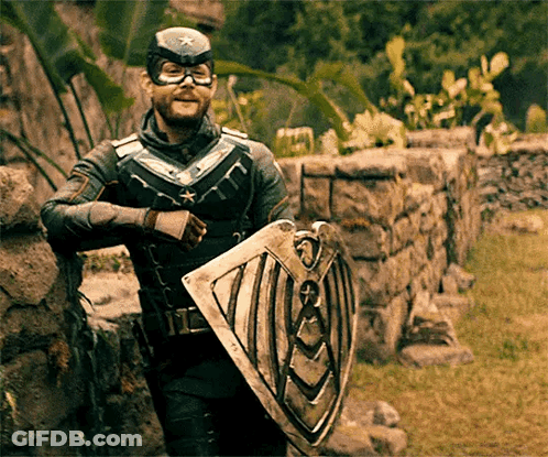 Superhero Man Leaning On Wall With Shield GIF
