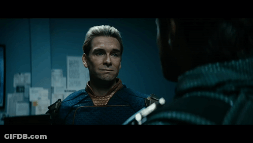 Superhero Man Looking At Papers GIF