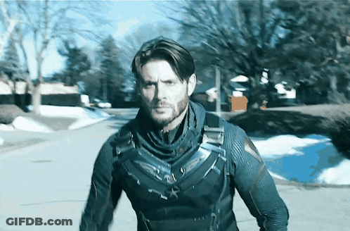 Superhero Man Walking On Snowy Street GIF