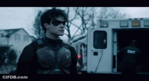 Superhero Standing In Front Of Ambulance GIF