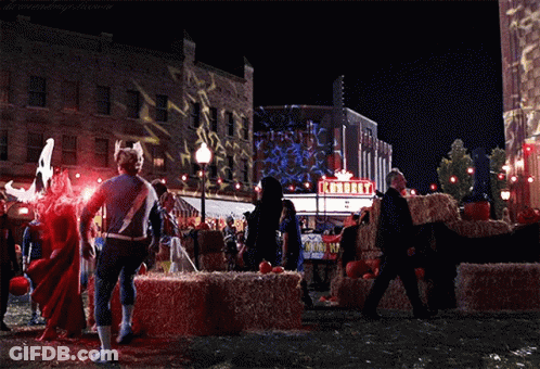 Superhero Standing In Front Of Knorry Theater GIF