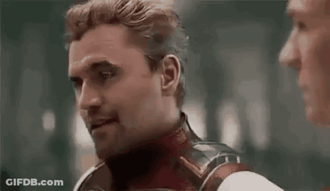 Superhero Talking To Man In Dark Room GIF