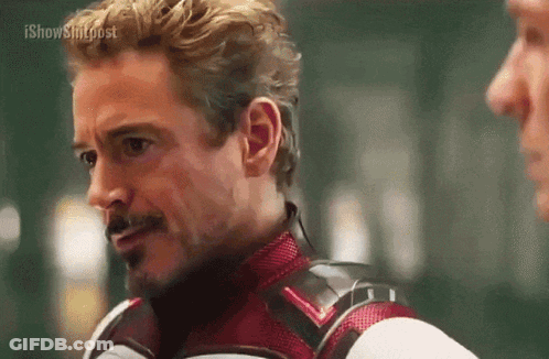 Superhero Talking To Man In Room GIF