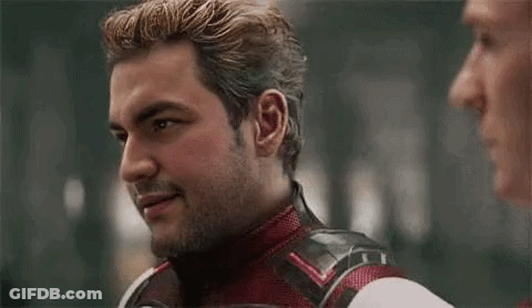 Superhero Talking To Man Making Funny Face GIF