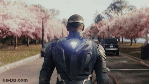 Superhero Walking Down Cherry Blossom Street GIF