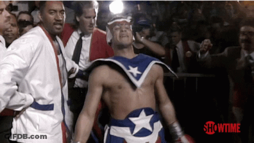 Superhero Walking In Front Of Showtime Sign GIF