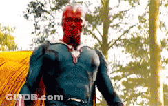 Superhero With Red Face Standing In Woods GIF