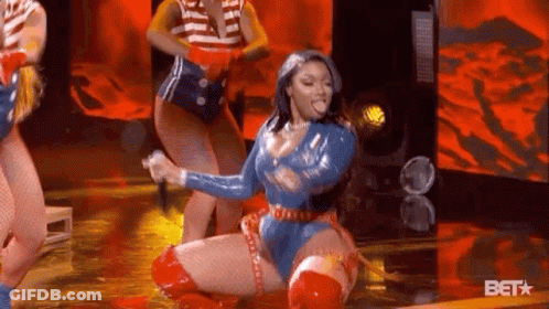 Superhero Woman Kneeling With Microphone GIF