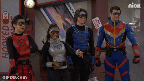 Superheroes Standing In Front Of Hooked On Nick Sign GIF