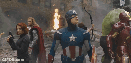 Superheros Including Captain America Standing Before Fire GIF