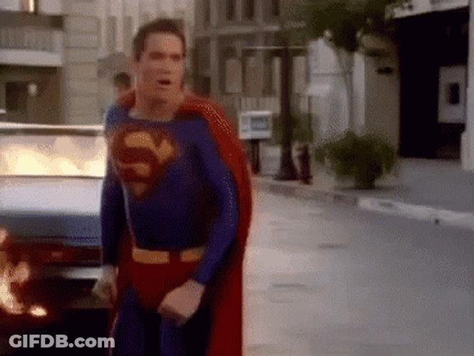 Superman Blow Air To Kill The Fire GIF