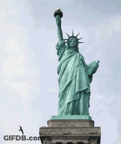 Superman Flying In Front Of Statue Of Liberty GIF