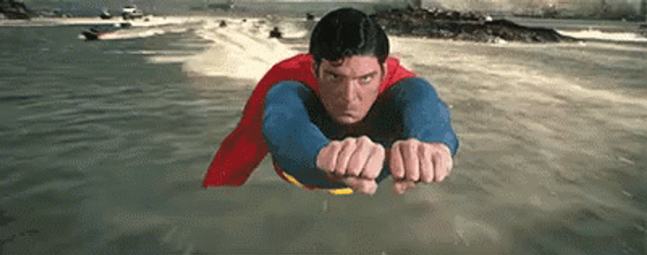 Superman Flying Over The Ocean GIF