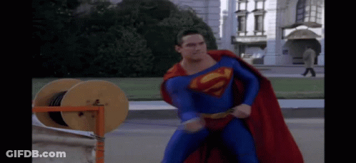 Superman Lying On Ground With Hands Up GIF