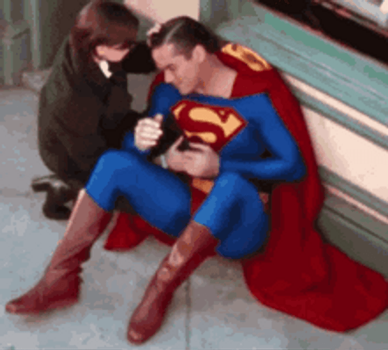Superman Rubbing His Belly GIF