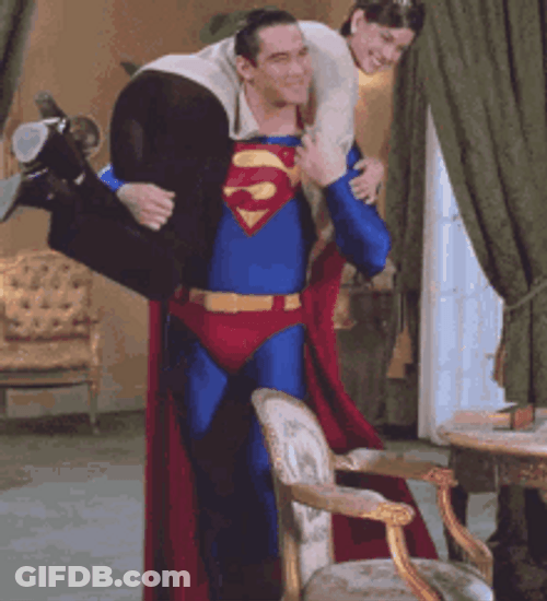 Superman Taking A Woman Over His Shoulder GIF