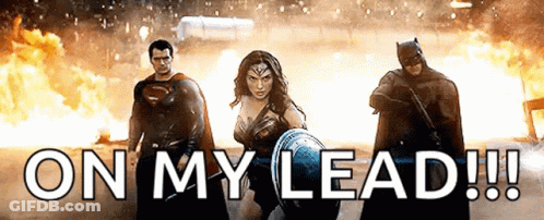 Superman , Wonder Woman And Batman Are Standing Next To Each Other In Front Of A Fire And The Words On My Lead ! GIF
