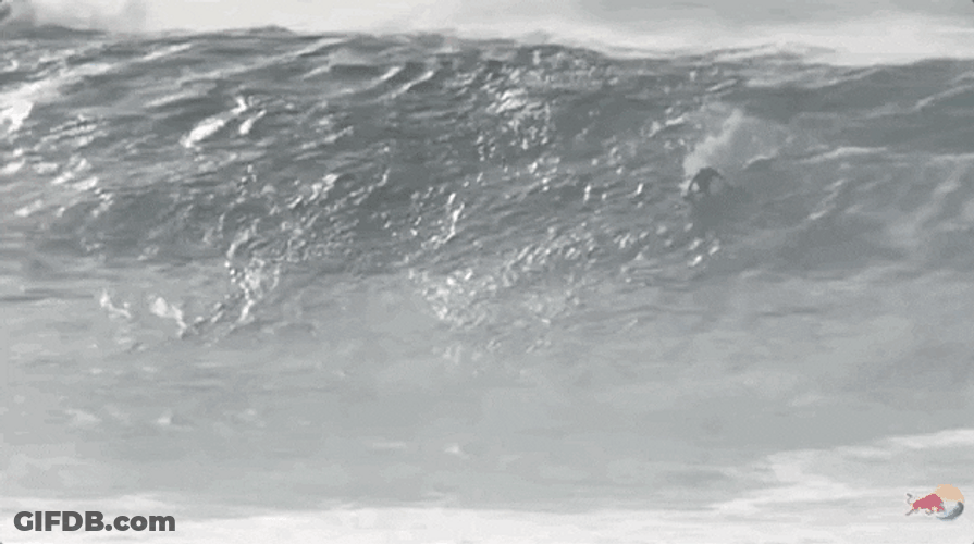Surfing Through Monster Blue Wave GIF
