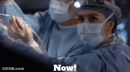 Surgeon In Mask And Gloves Operating Saying Now GIF