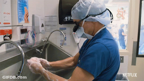 Surgeon Washing Hands In Front Of Netflix Sign GIF